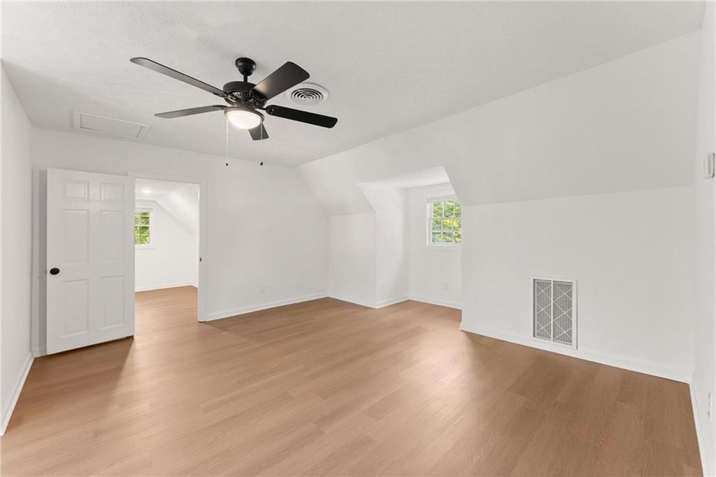 225 Northview Drive Commerce, GA 30529 - Photo 22 of 39 a view of empty room with wooden floor and ceiling fan