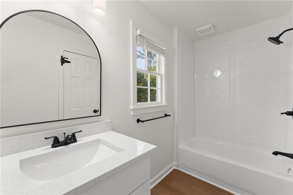 225 Northview Drive Commerce, GA 30529 - Photo 25 of 39 a bathroom with a sink a bathtub and a mirror