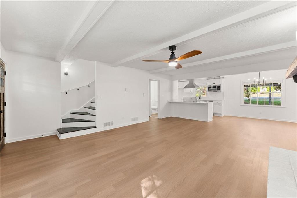 225 Northview Drive Commerce, GA 30529 - Photo 6 of 39 wooden floor in an empty room with a window