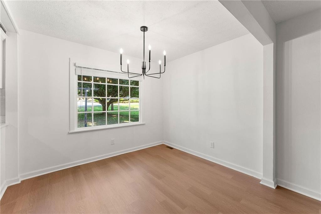 225 Northview Drive Commerce, GA 30529 - Photo 8 of 39 a view of empty room with windows