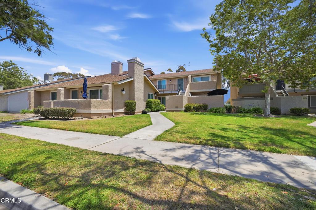5154 Jefferson Square Oxnard, CA 93033 - Photo 1 of 23 a view of house with a big yard and potted plants