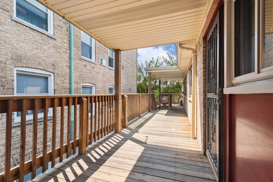 7019 North Ridge Boulevard, Unit 3B Chicago, IL 60645 - Photo 9 of 9 a view of a balcony with wooden floor