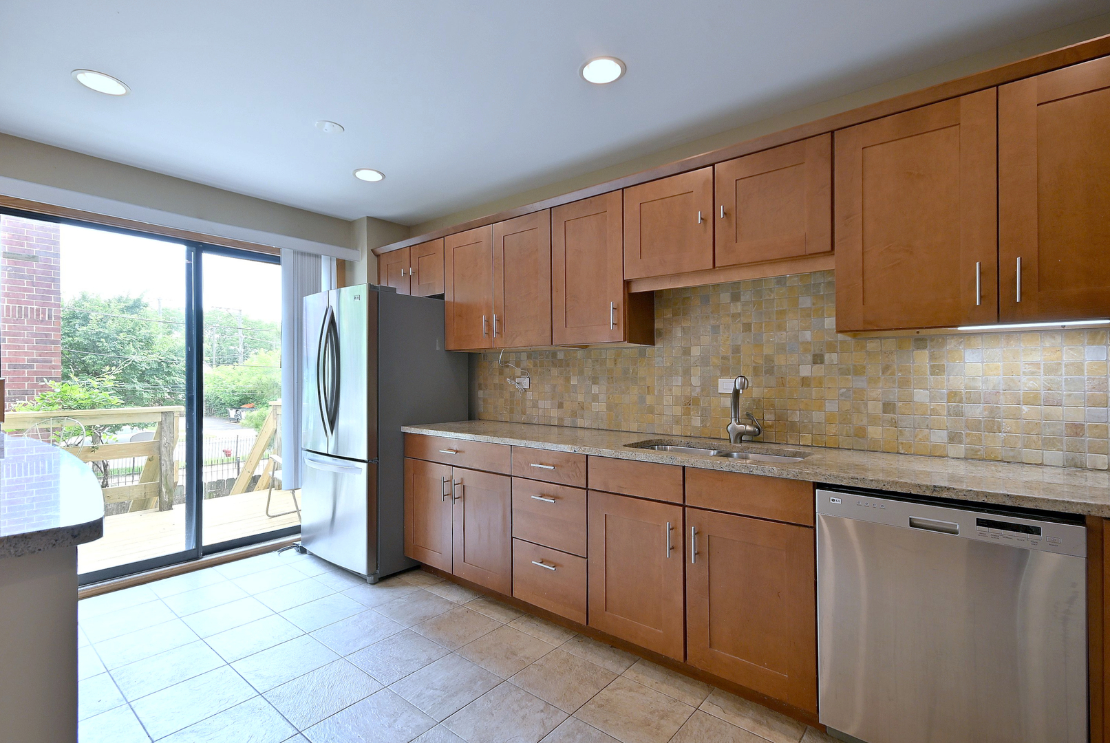 2350 North Sayre Avenue, Unit G Chicago, IL 60707 - Photo 10 of 30 a kitchen with stainless steel appliances granite countertop a refrigerator sink and cabinets
