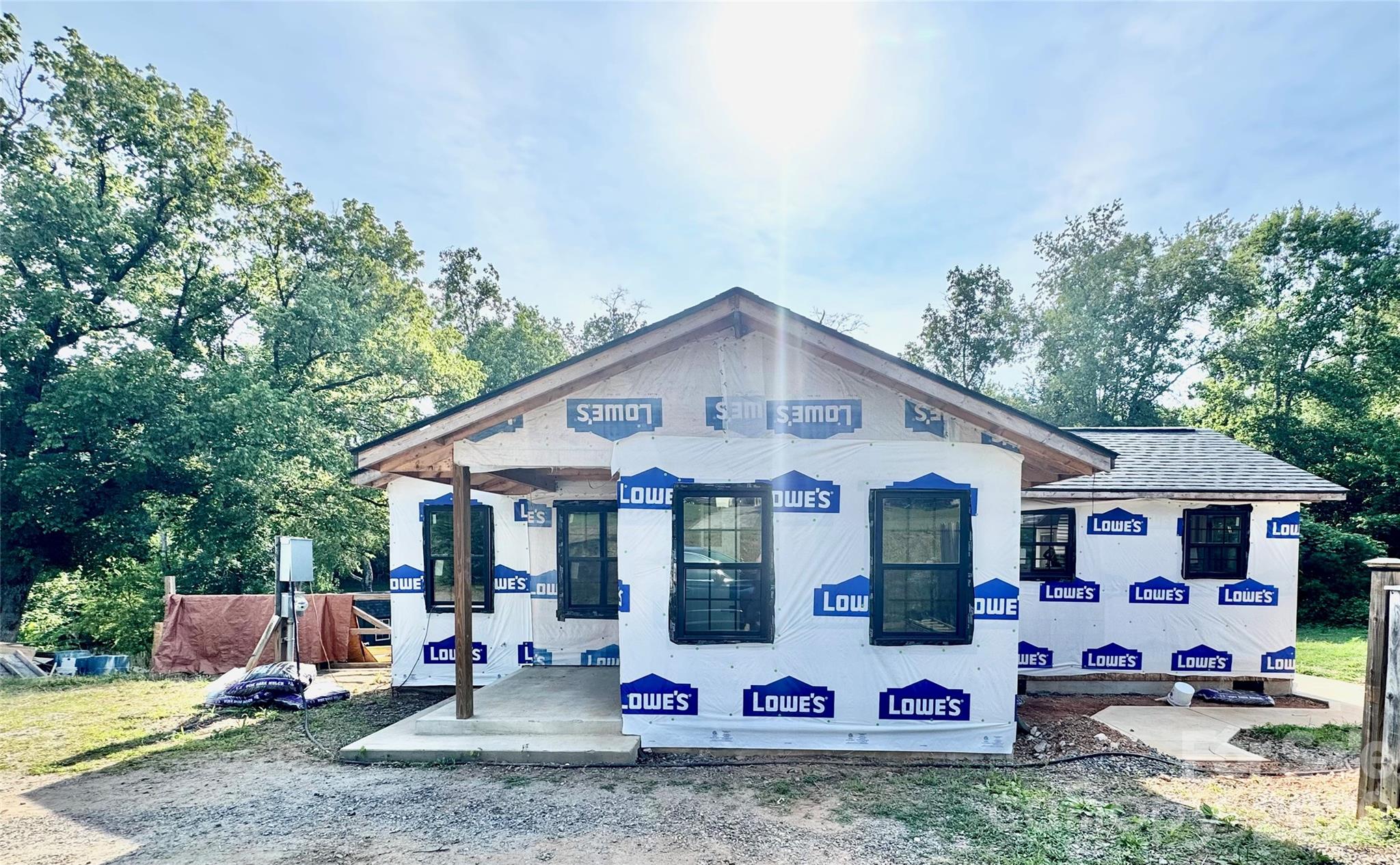 714 Dudley Shoals Road Granite Falls, NC 28630 - Photo 1 of 15 a view of patio with a table and chairs under an umbrella