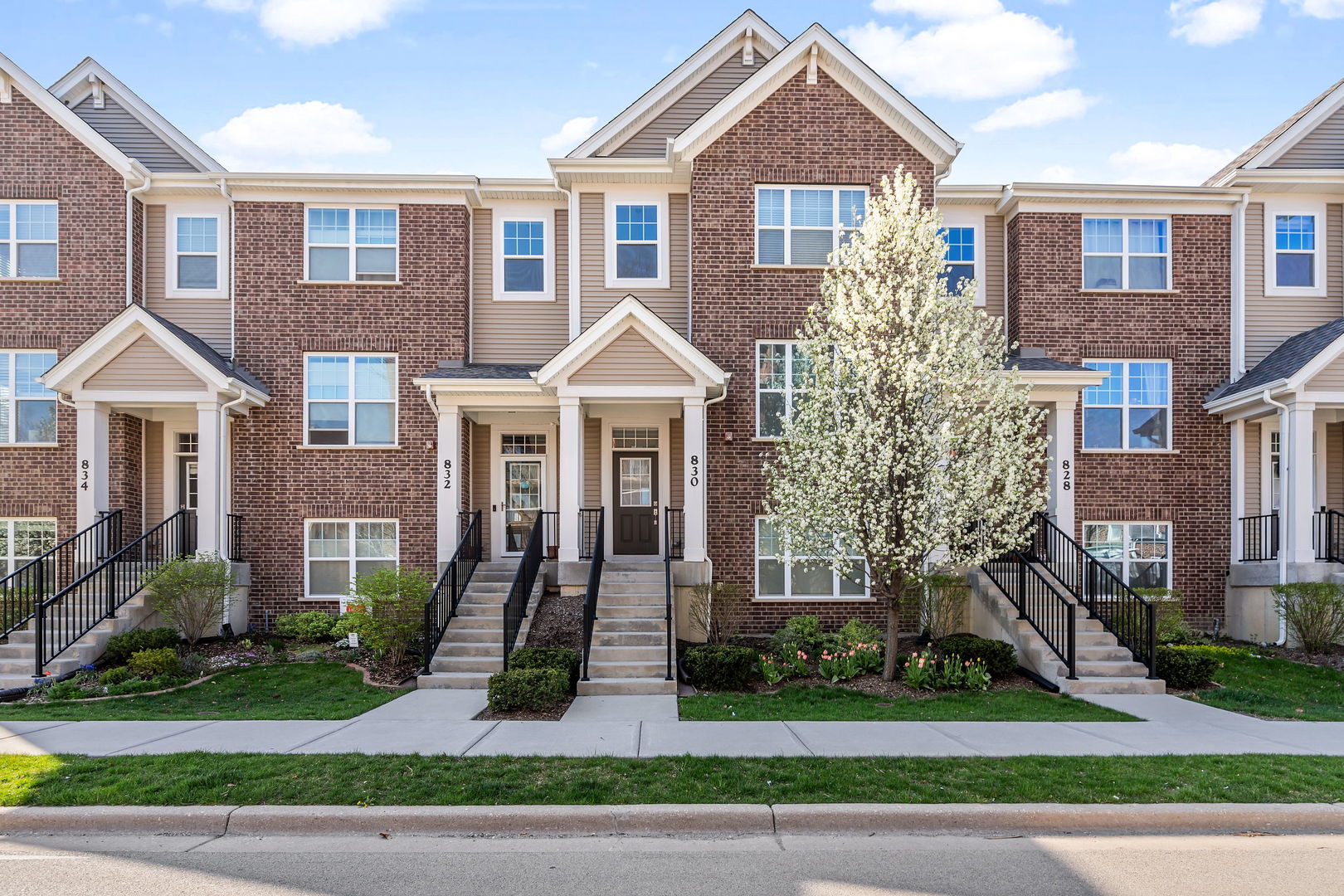 830 Center Street Des Plaines, IL 60016 - Photo 1 of 16 a front view of a house with a yard