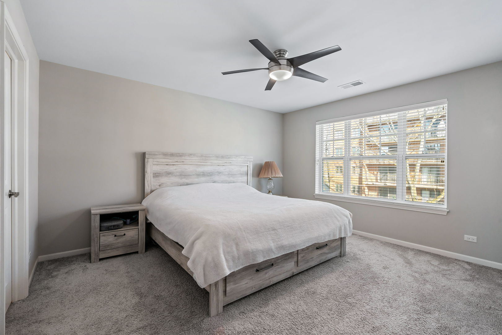 830 Center Street Des Plaines, IL 60016 - Photo 11 of 16 a bedroom with a bed and window
