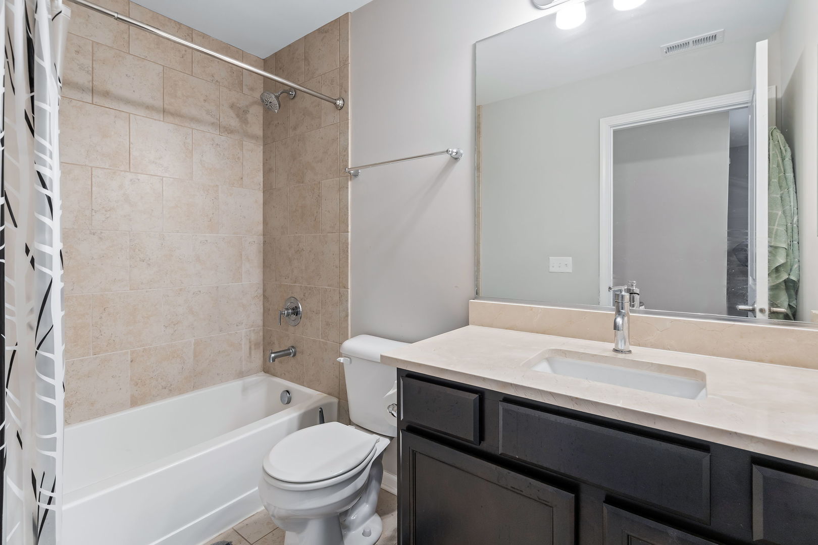 830 Center Street Des Plaines, IL 60016 - Photo 15 of 16 a bathroom with a sink a toilet and a mirror