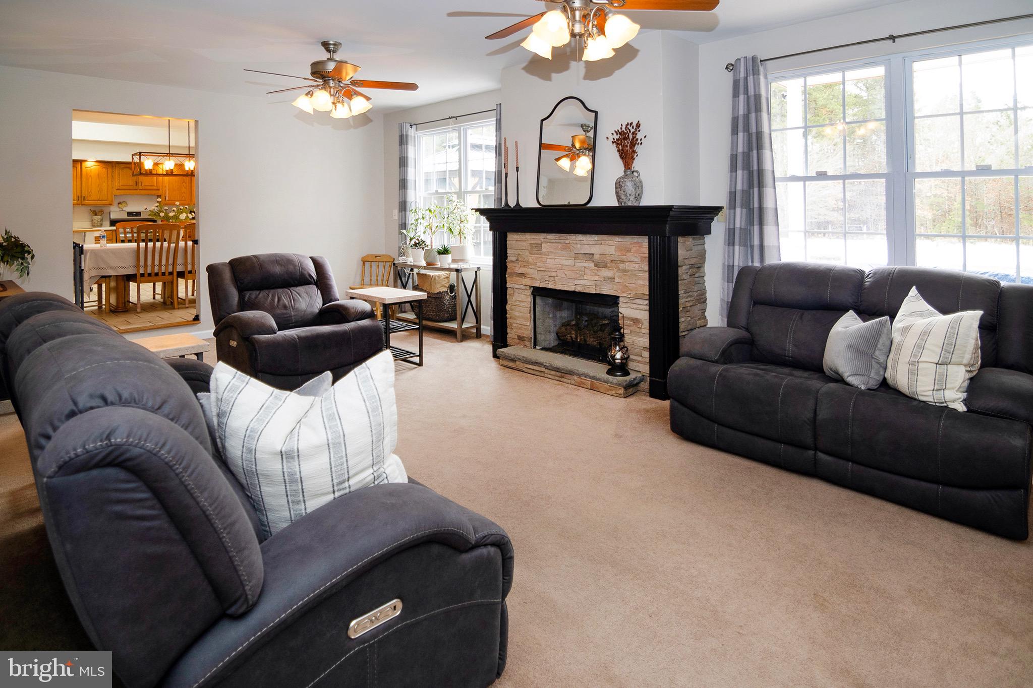 4643 Jackson Road Williamstown, NJ 08094 - Photo 25 of 74 a living room with furniture a fireplace and a large window