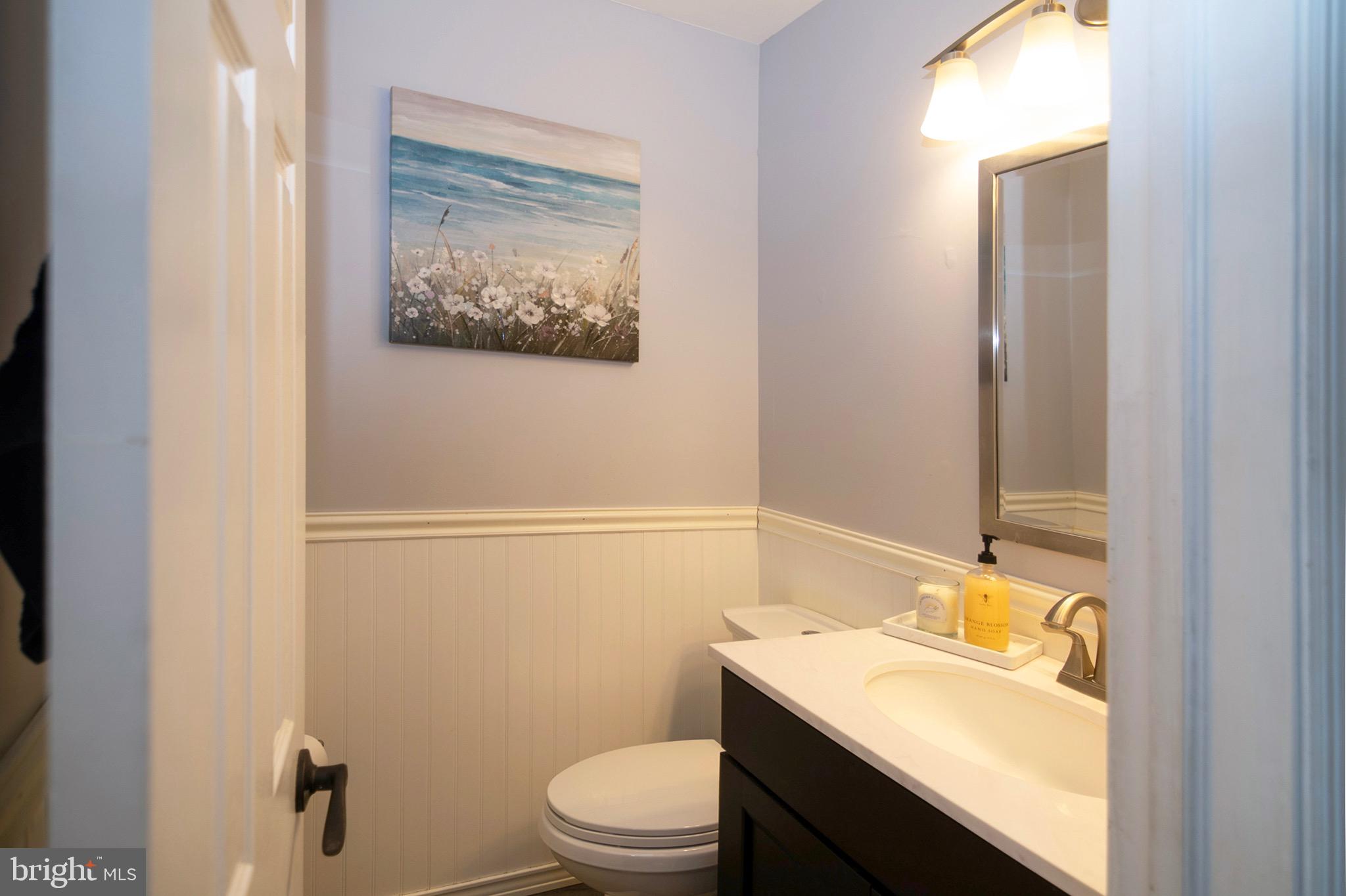 4643 Jackson Road Williamstown, NJ 08094 - Photo 27 of 74 a bathroom with a granite countertop sink a toilet and a mirror
