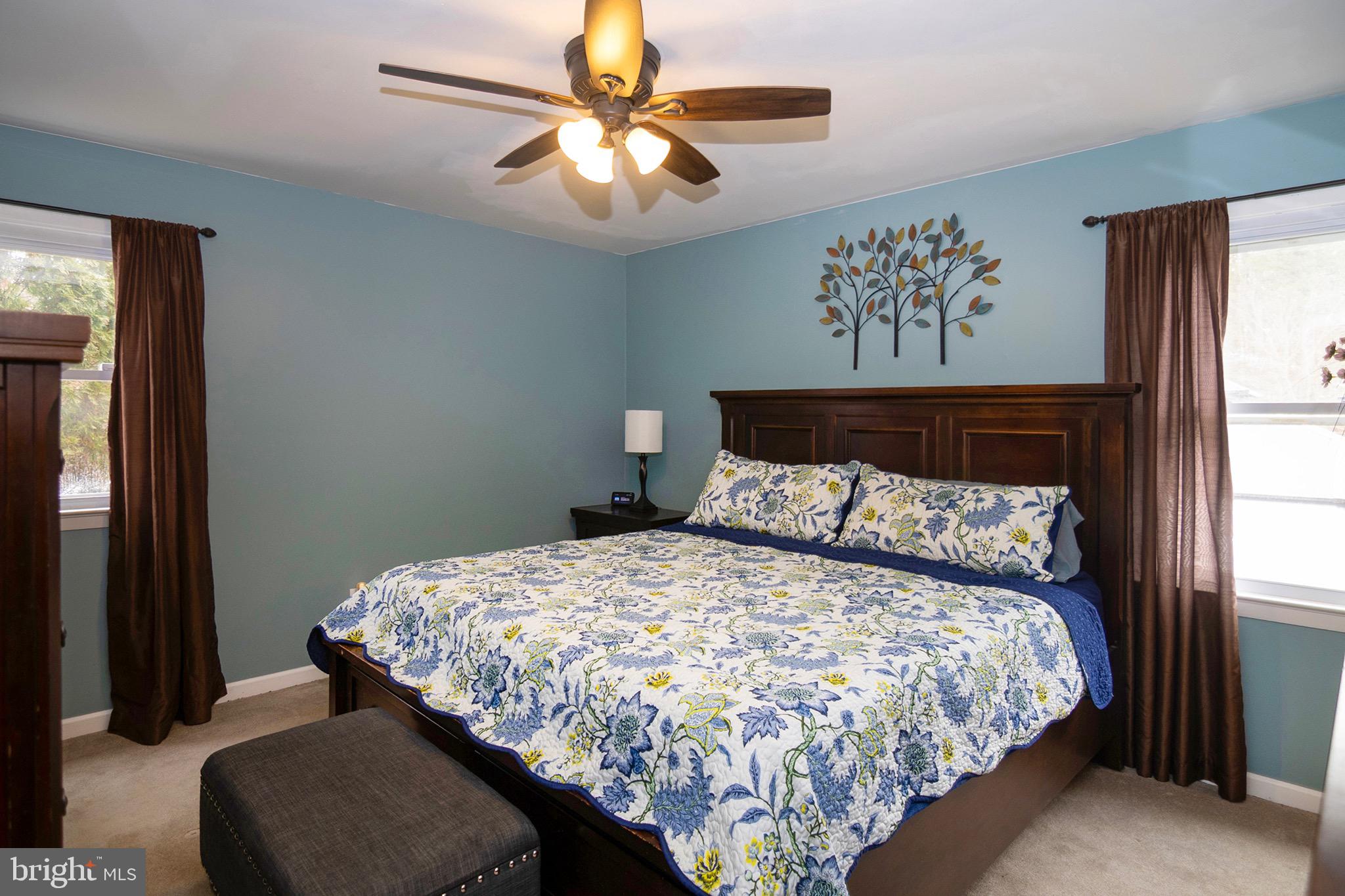 4643 Jackson Road Williamstown, NJ 08094 - Photo 28 of 74 a bedroom with a large bed and a chandelier