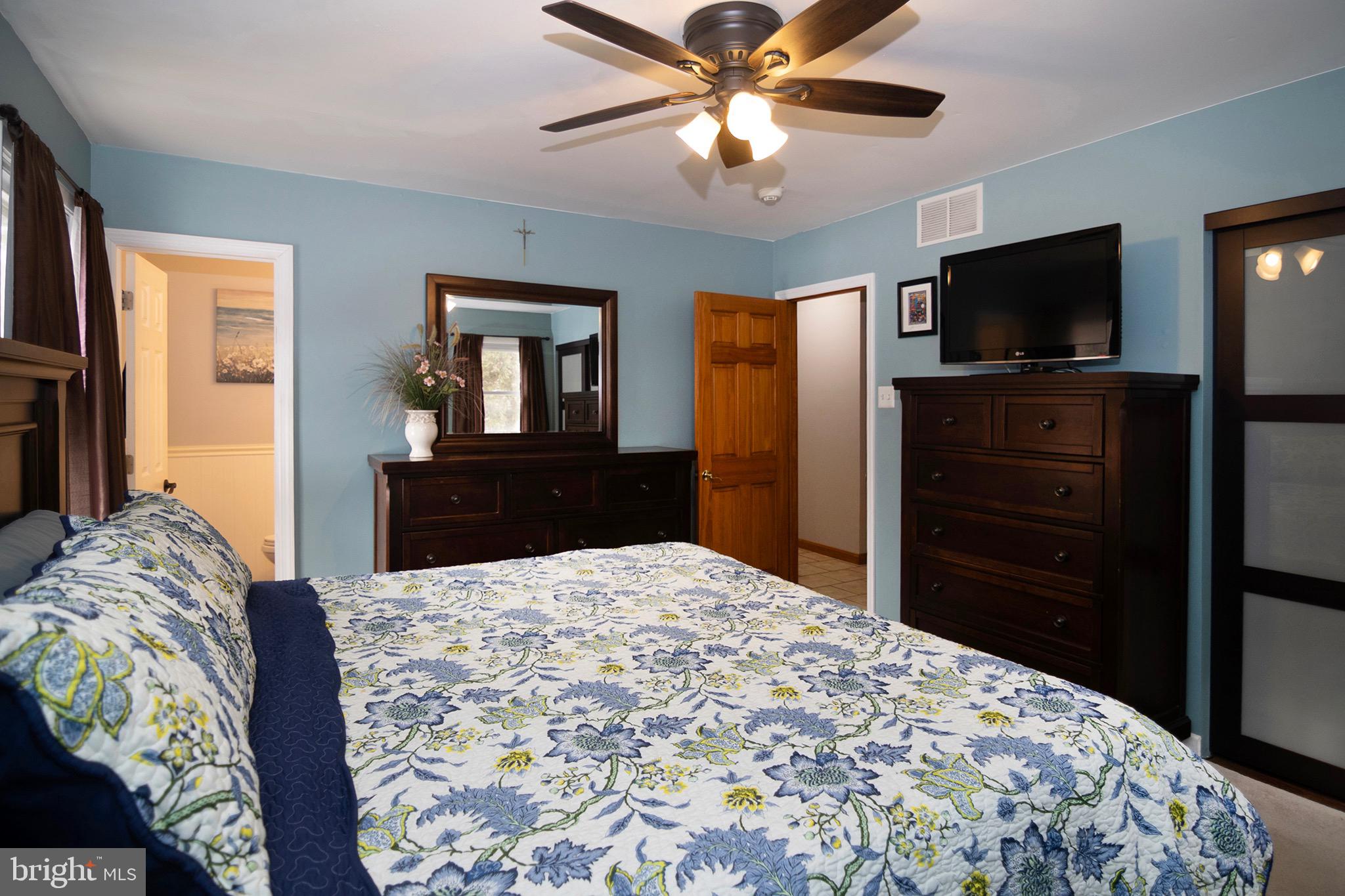 4643 Jackson Road Williamstown, NJ 08094 - Photo 29 of 74 a bedroom with a bed and a flat screen tv