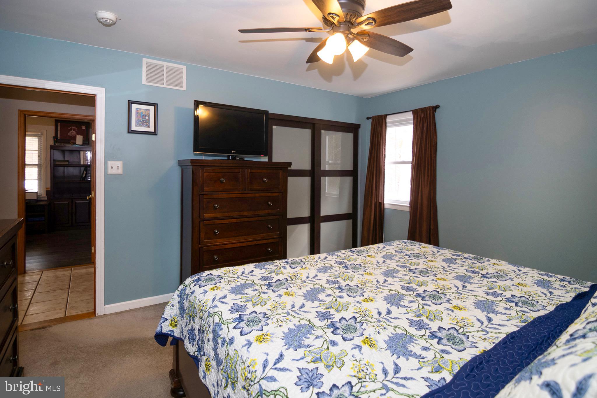 4643 Jackson Road Williamstown, NJ 08094 - Photo 30 of 74 a bedroom with a bed and a flat screen tv