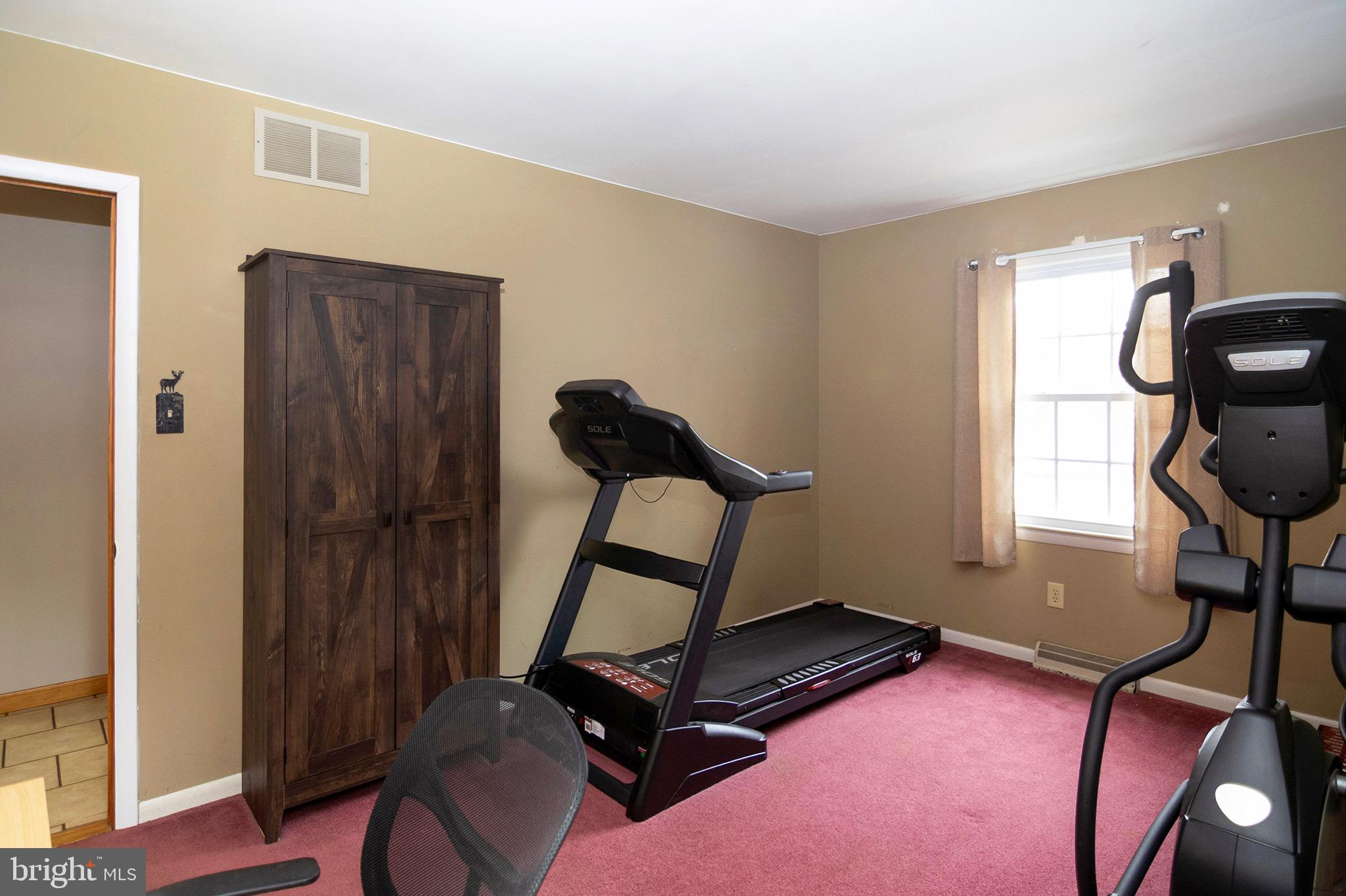 4643 Jackson Road Williamstown, NJ 08094 - Photo 35 of 74 a room with gym equipment and windows