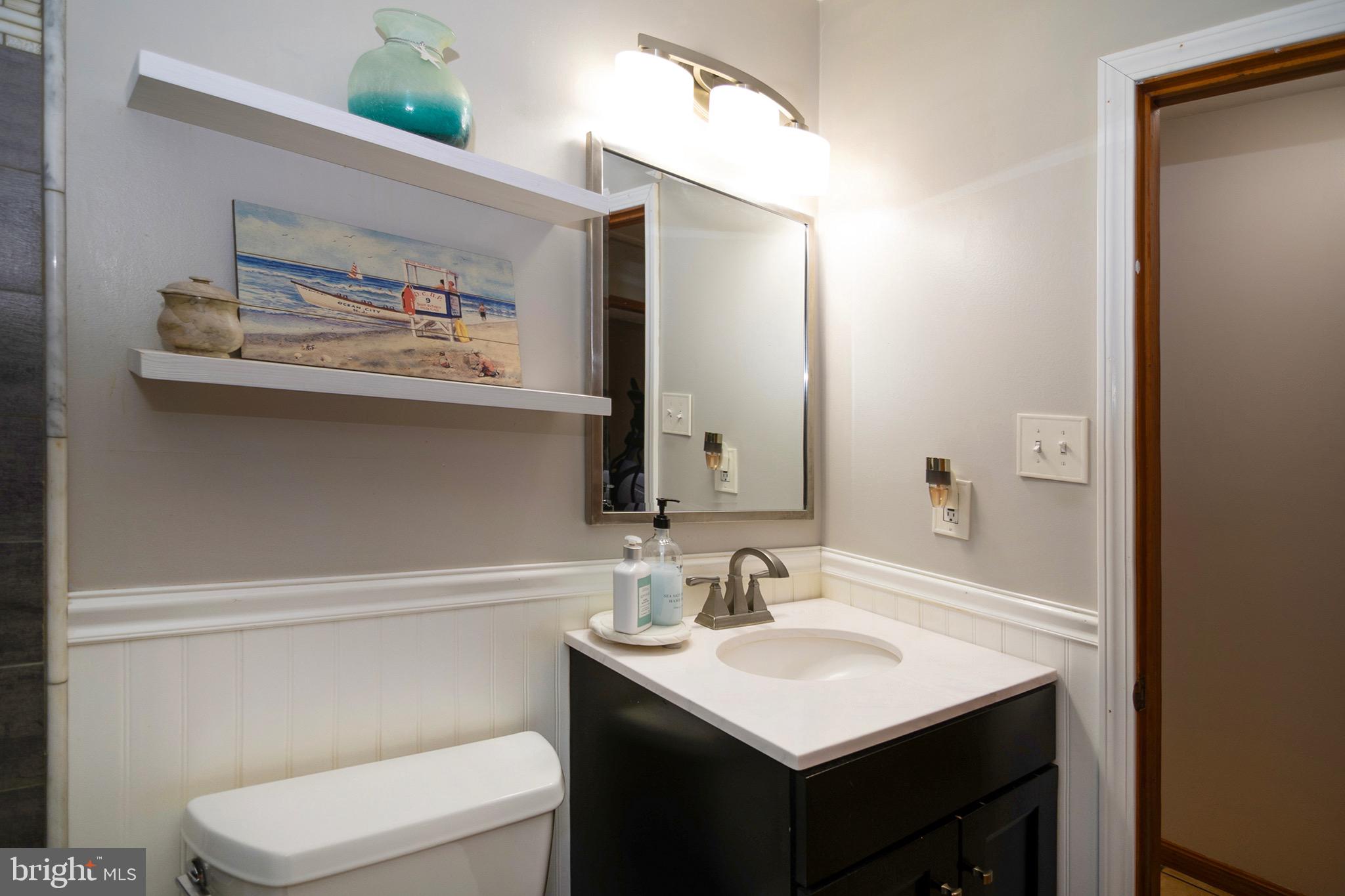 4643 Jackson Road Williamstown, NJ 08094 - Photo 38 of 74 a bathroom with a toilet a sink and mirror