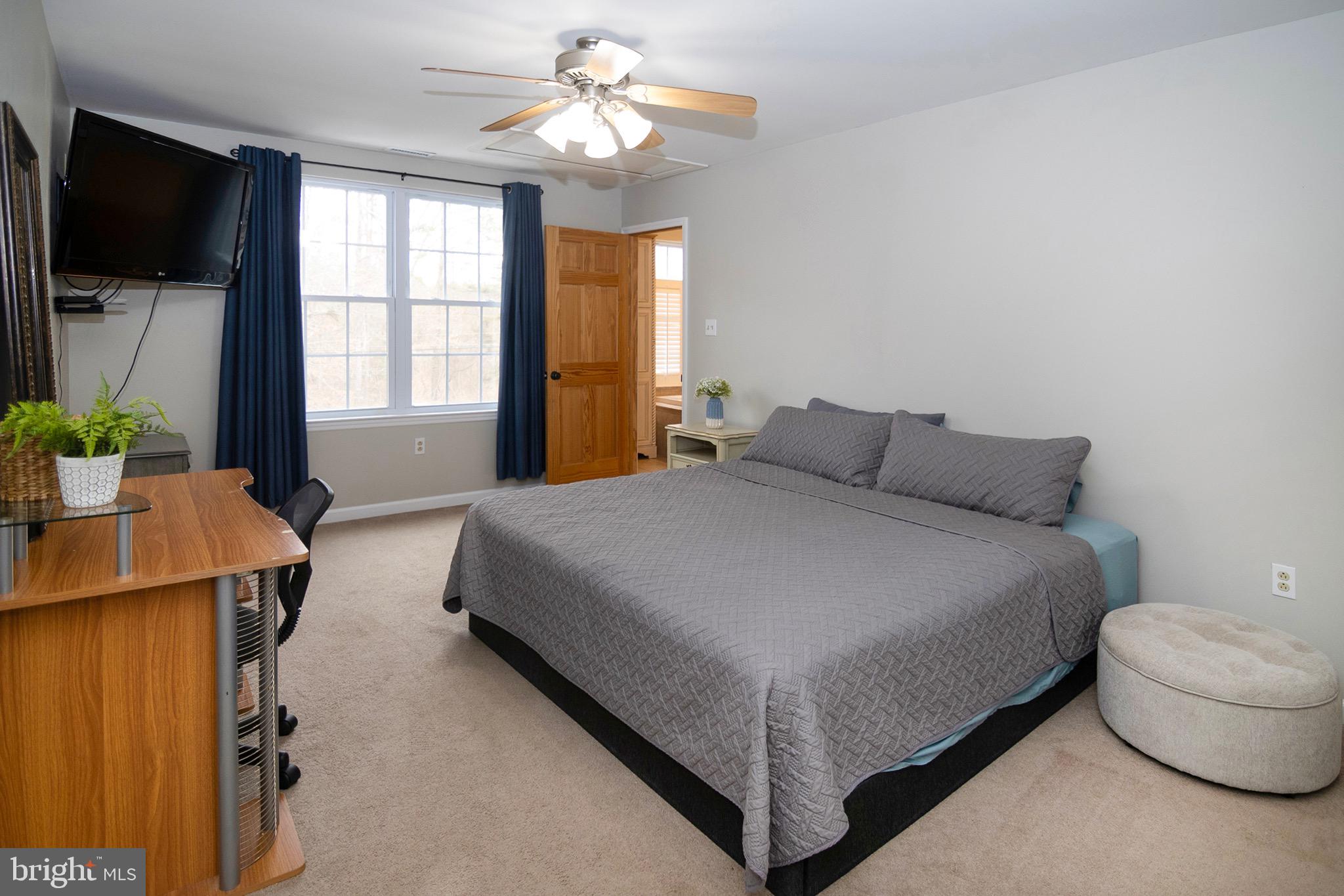 4643 Jackson Road Williamstown, NJ 08094 - Photo 50 of 74 a bedroom with a bed and a flat screen tv