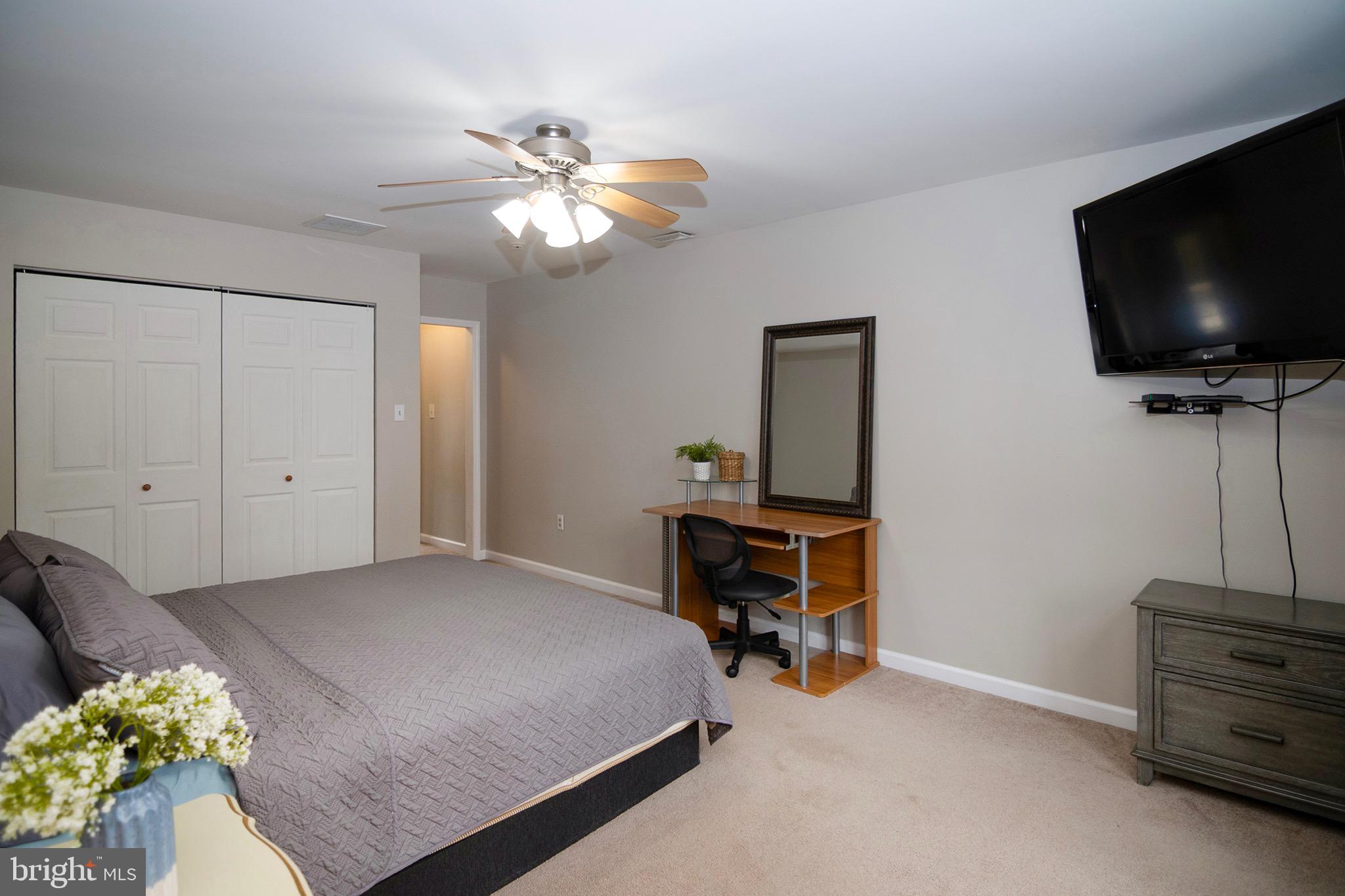 4643 Jackson Road Williamstown, NJ 08094 - Photo 52 of 74 a bedroom with a bed and a flat screen tv