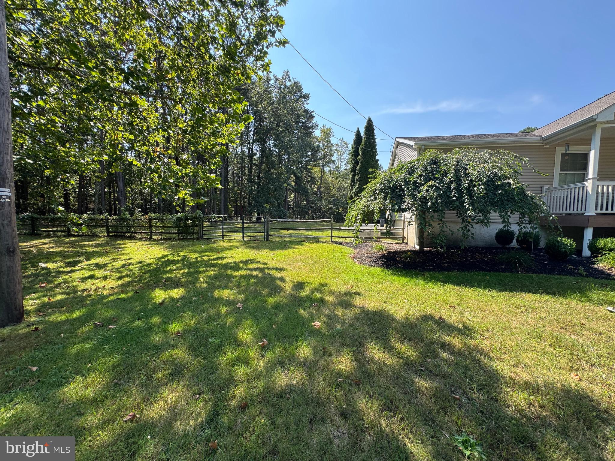 4643 Jackson Road Williamstown, NJ 08094 - Photo 58 of 67 a view of a swimming pool with an outdoor seating and a yard