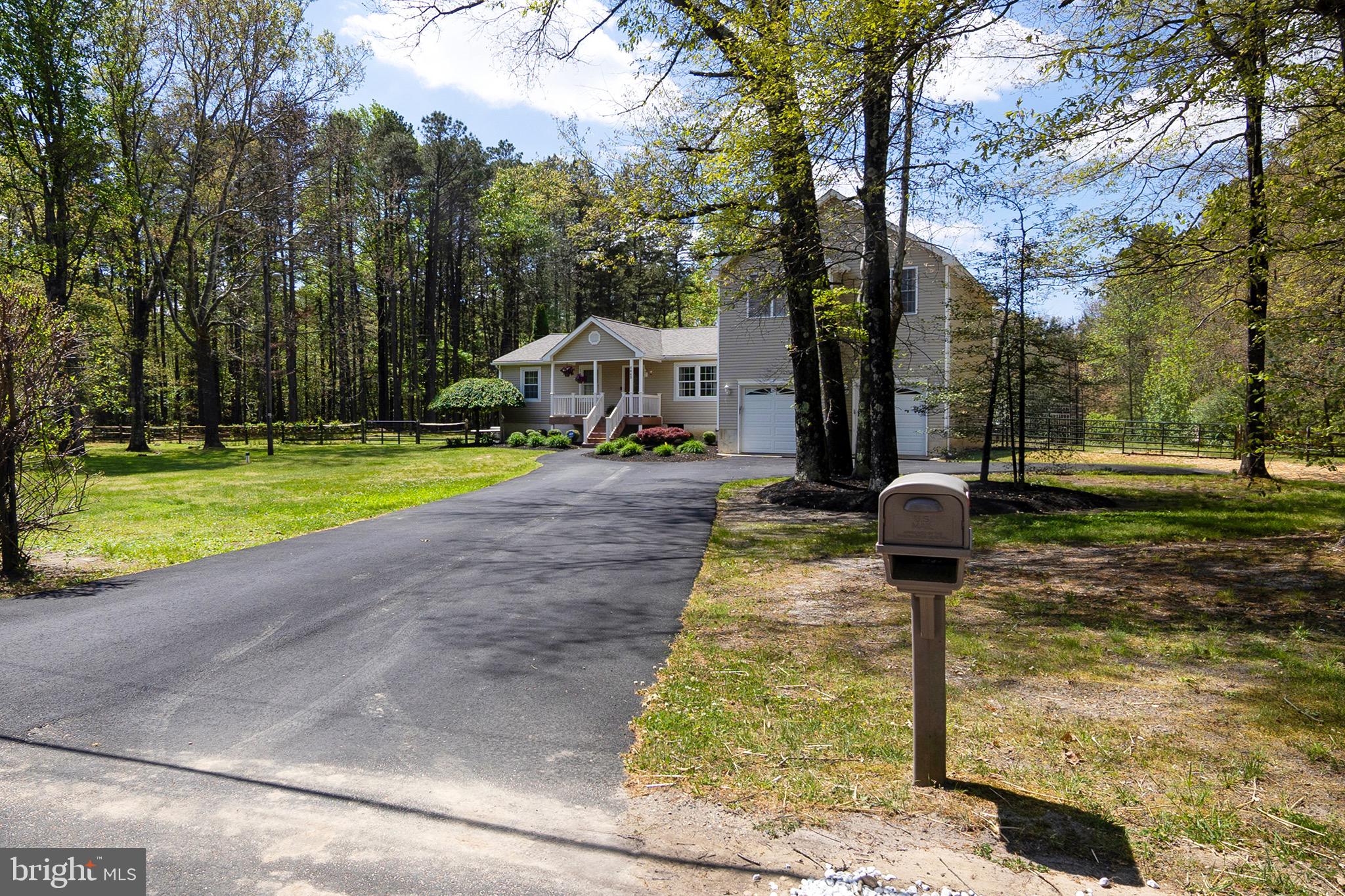 4643 Jackson Road Williamstown, NJ 08094 - Photo 7 of 74 a front view of a house with garden and trees