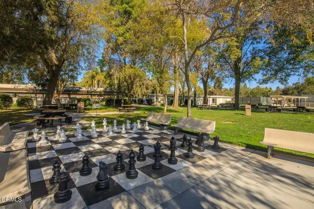 a view of pool and trees in the background