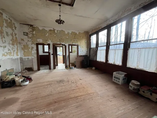 a spacious bedroom with a bed and a window