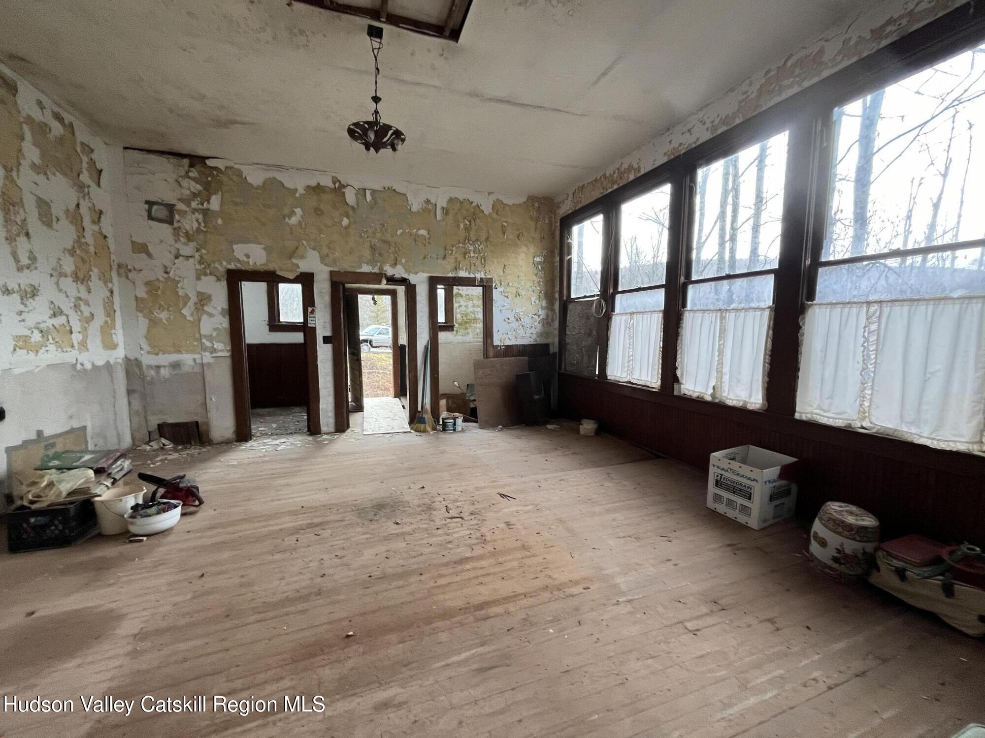 19 Truesdell Road Lexington, NY 12468 - Photo 6 of 22 a spacious bedroom with a bed and a window