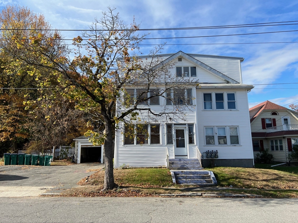 172 Chester Street Fitchburg, MA 01420 - Photo 1 of 22 a front view of a house with a garden
