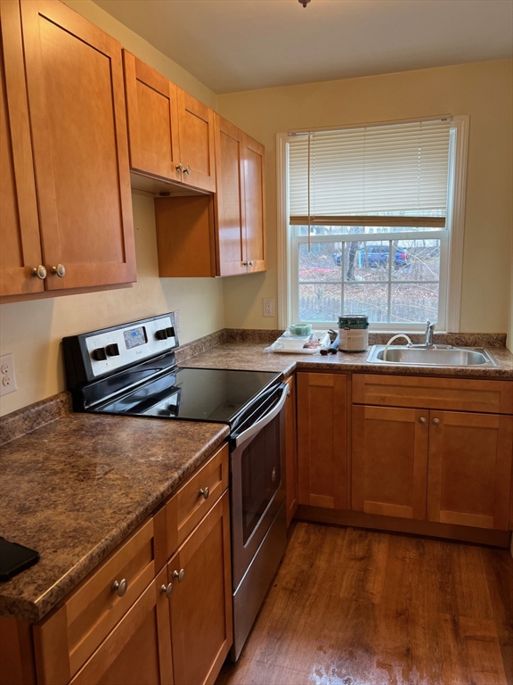 172 Chester Street Fitchburg, MA 01420 - Photo 11 of 22 a kitchen with stainless steel appliances granite countertop a sink a stove and a microwave