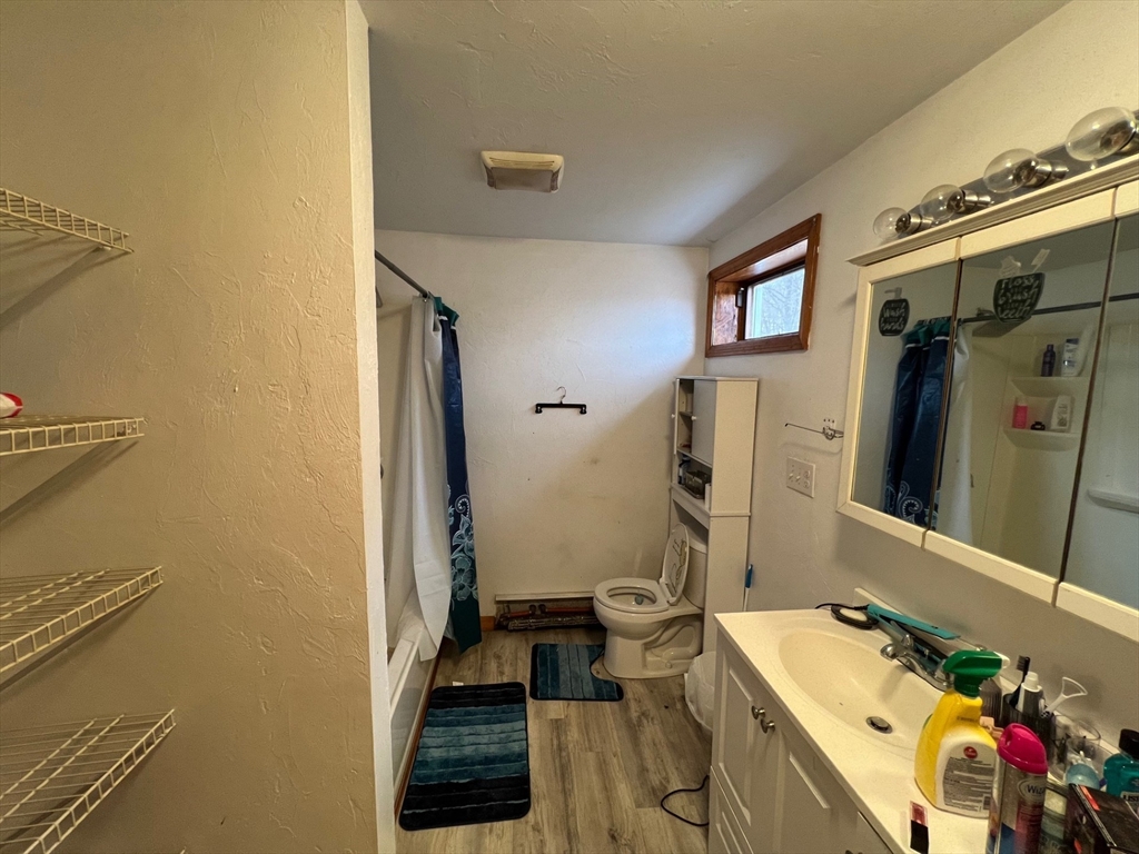 172 Chester Street Fitchburg, MA 01420 - Photo 13 of 22 a bathroom with a granite countertop sink and a mirror