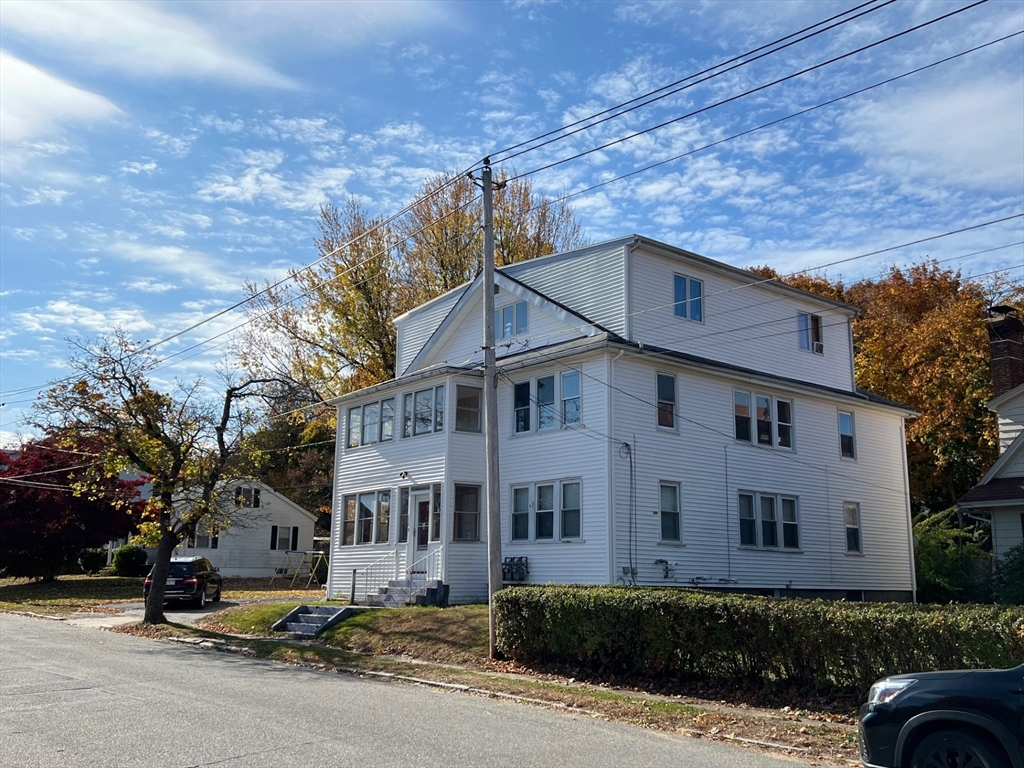 172 Chester Street Fitchburg, MA 01420 - Photo 3 of 22 a front view of a house with a yard