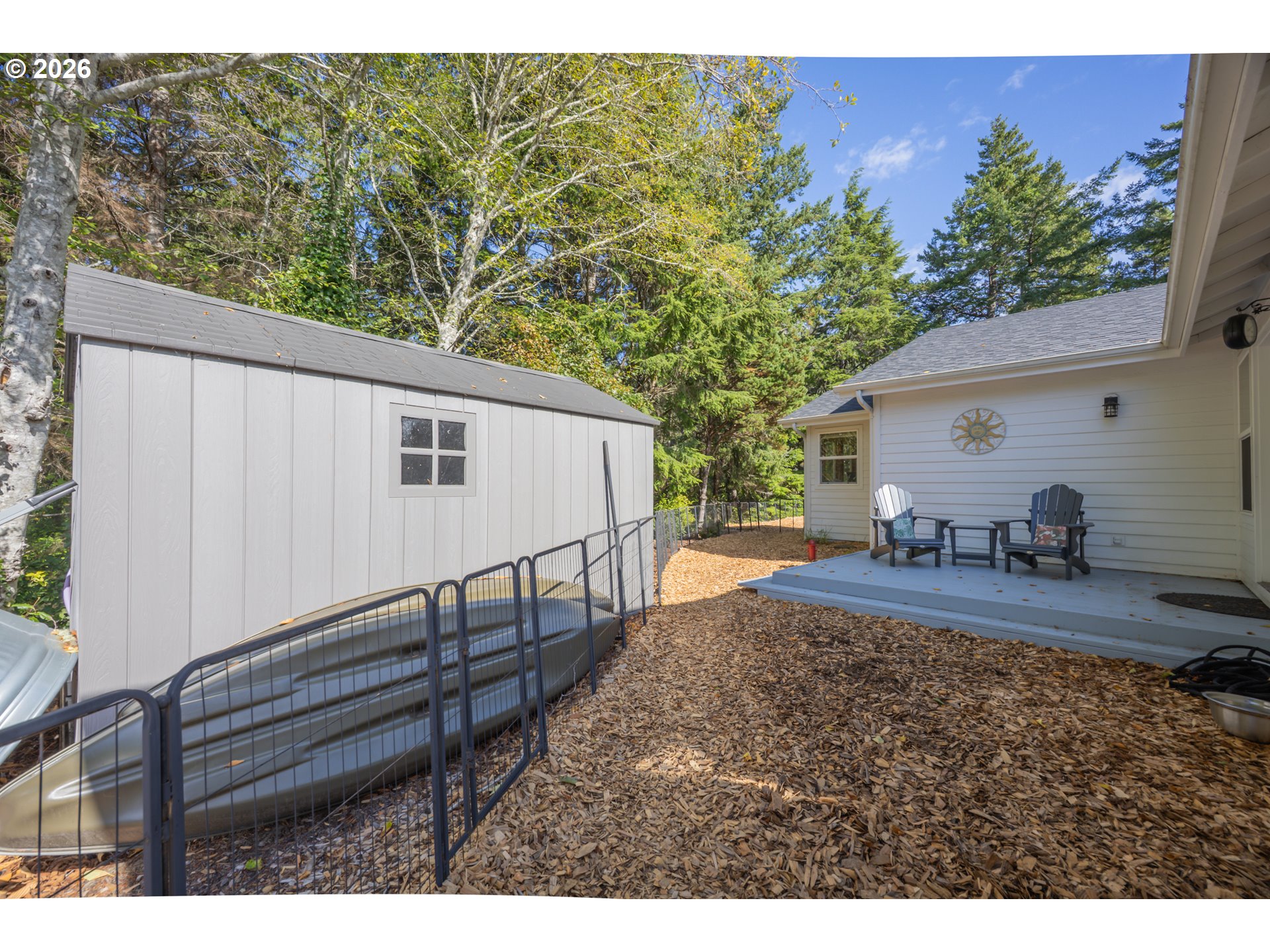 2193 13th Street Florence, OR 97439 - Photo 45 of 48 a view of a backyard with a patio