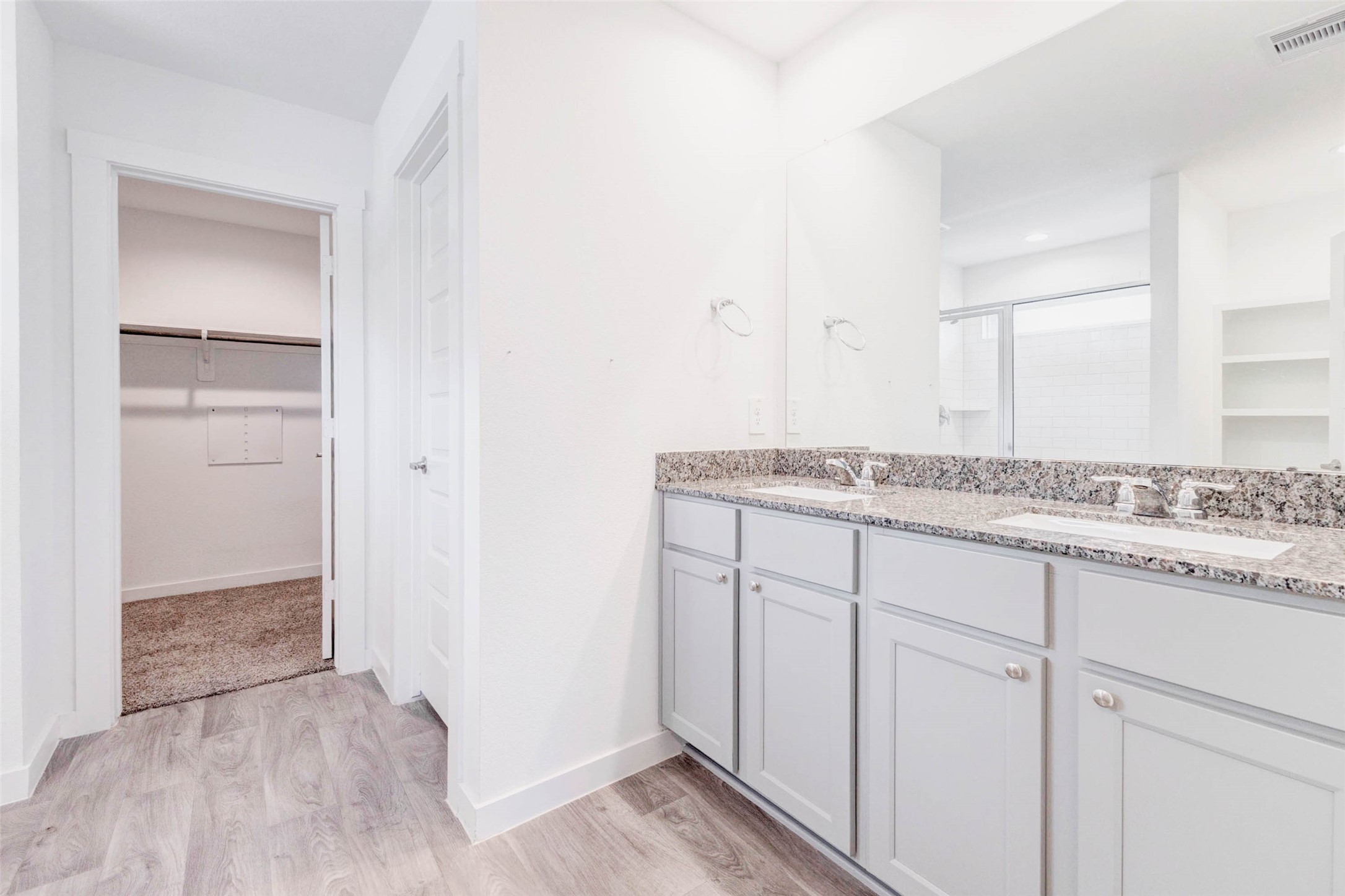 3903 Beltingham Bend Way Fulshear, TX 77441 - Photo 11 of 27 a bathroom with a granite countertop sink and a mirror