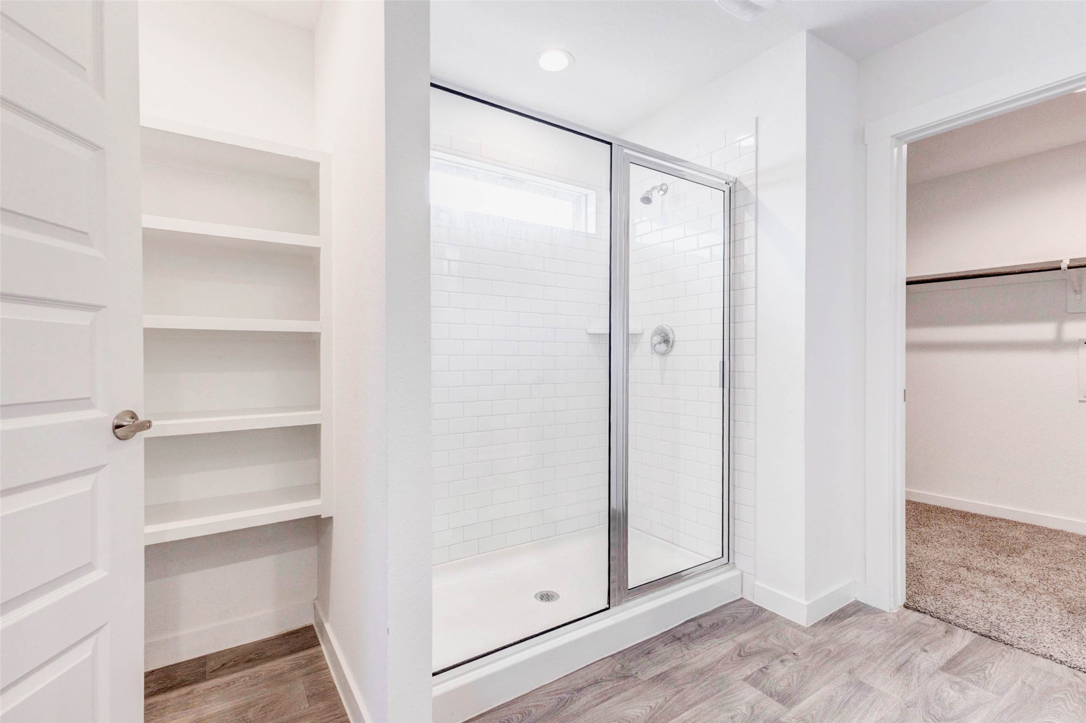 3903 Beltingham Bend Way Fulshear, TX 77441 - Photo 12 of 27 a bathroom with a glass shower door