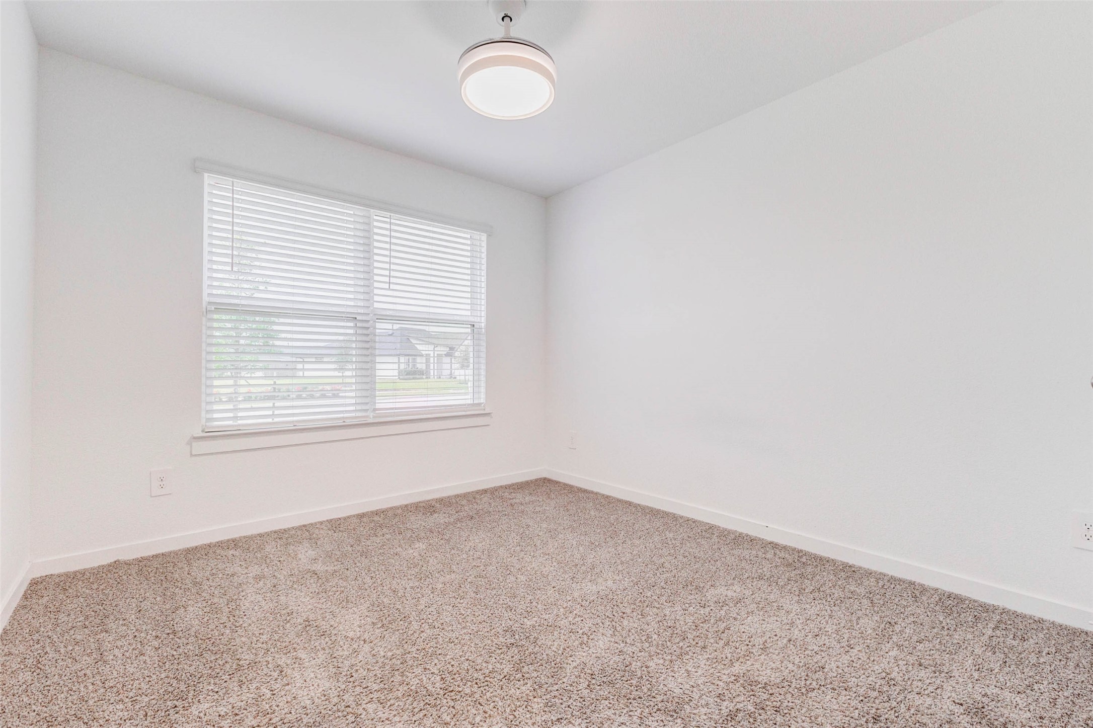 3903 Beltingham Bend Way Fulshear, TX 77441 - Photo 15 of 27 an empty room with a window