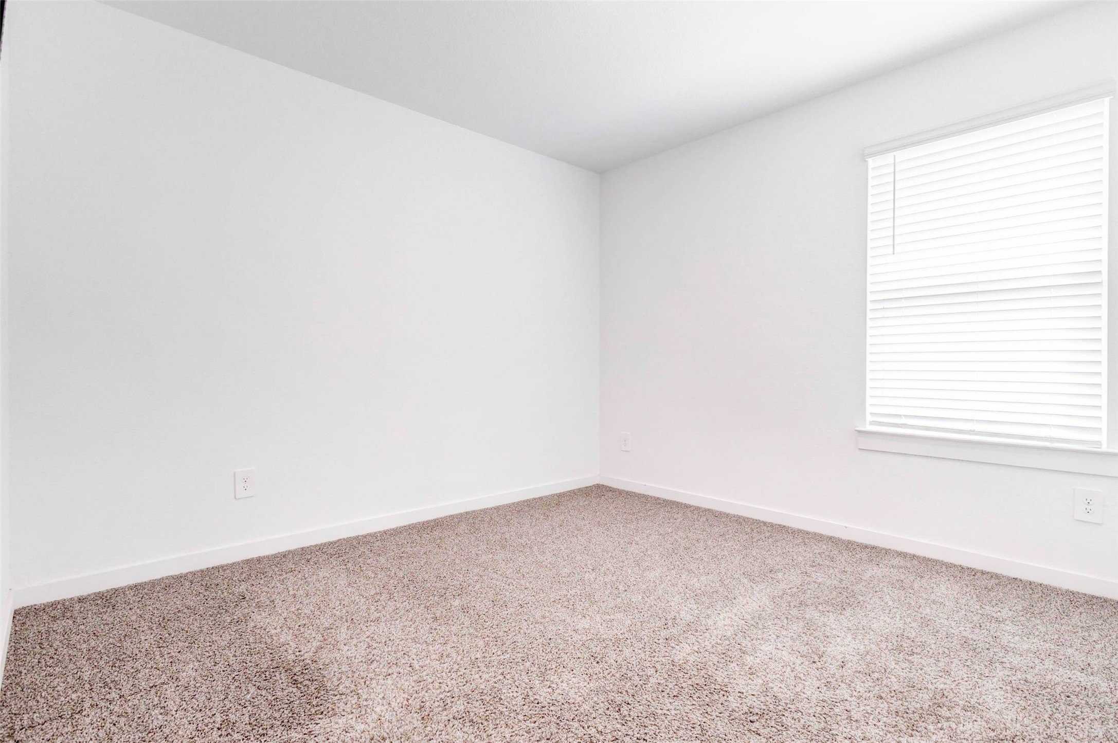 3903 Beltingham Bend Way Fulshear, TX 77441 - Photo 20 of 27 an empty room with a window