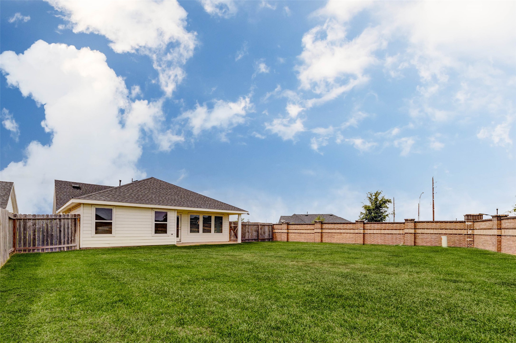3903 Beltingham Bend Way Fulshear, TX 77441 - Photo 22 of 27 a view of a house with backyard and garden