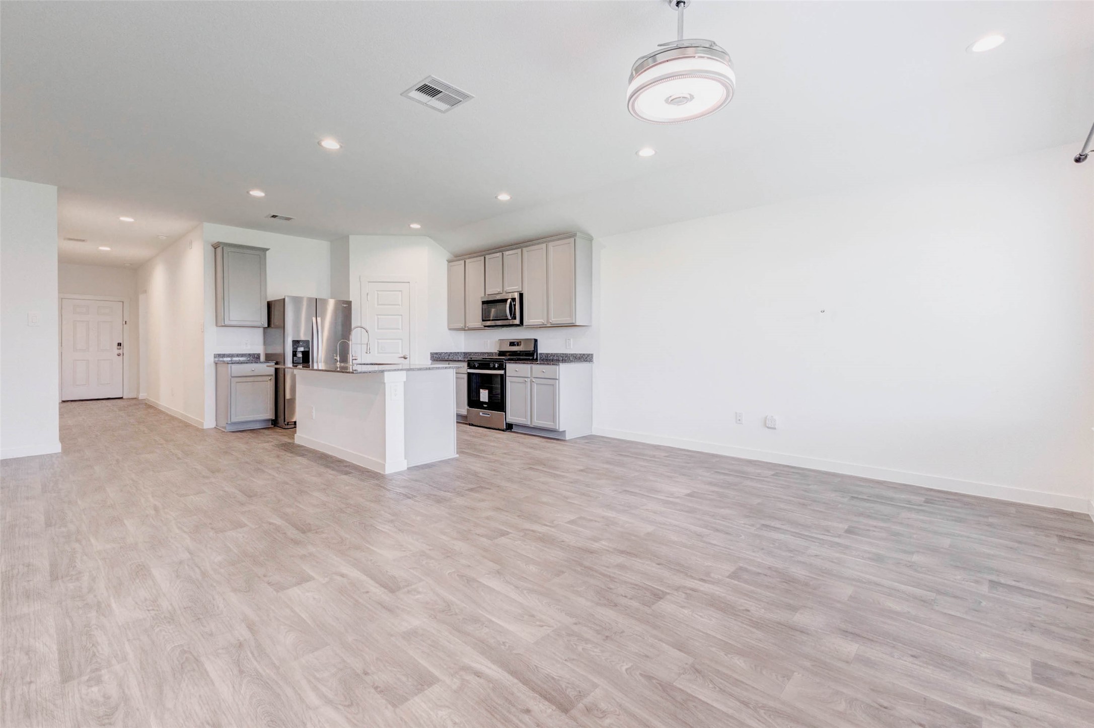 3903 Beltingham Bend Way Fulshear, TX 77441 - Photo 3 of 27 a view of a kitchen with a sink