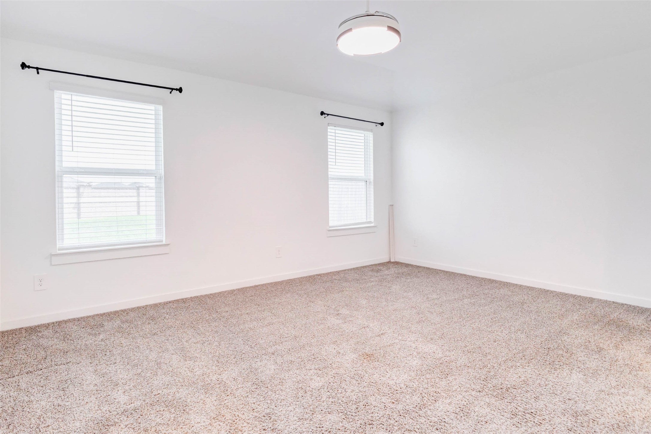 3903 Beltingham Bend Way Fulshear, TX 77441 - Photo 8 of 27 an empty room with windows
