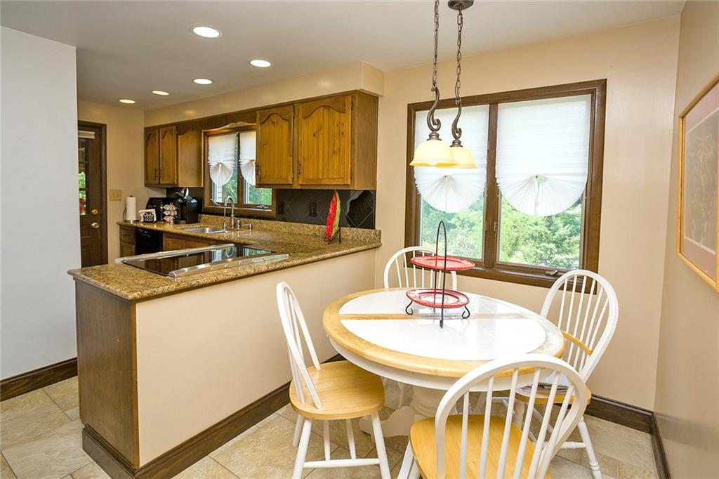 2225 Ramsey Road Monroeville, PA 15146 - Photo 8 of 25 The eat in granite kitchen has recessed lights and a porcelain floor