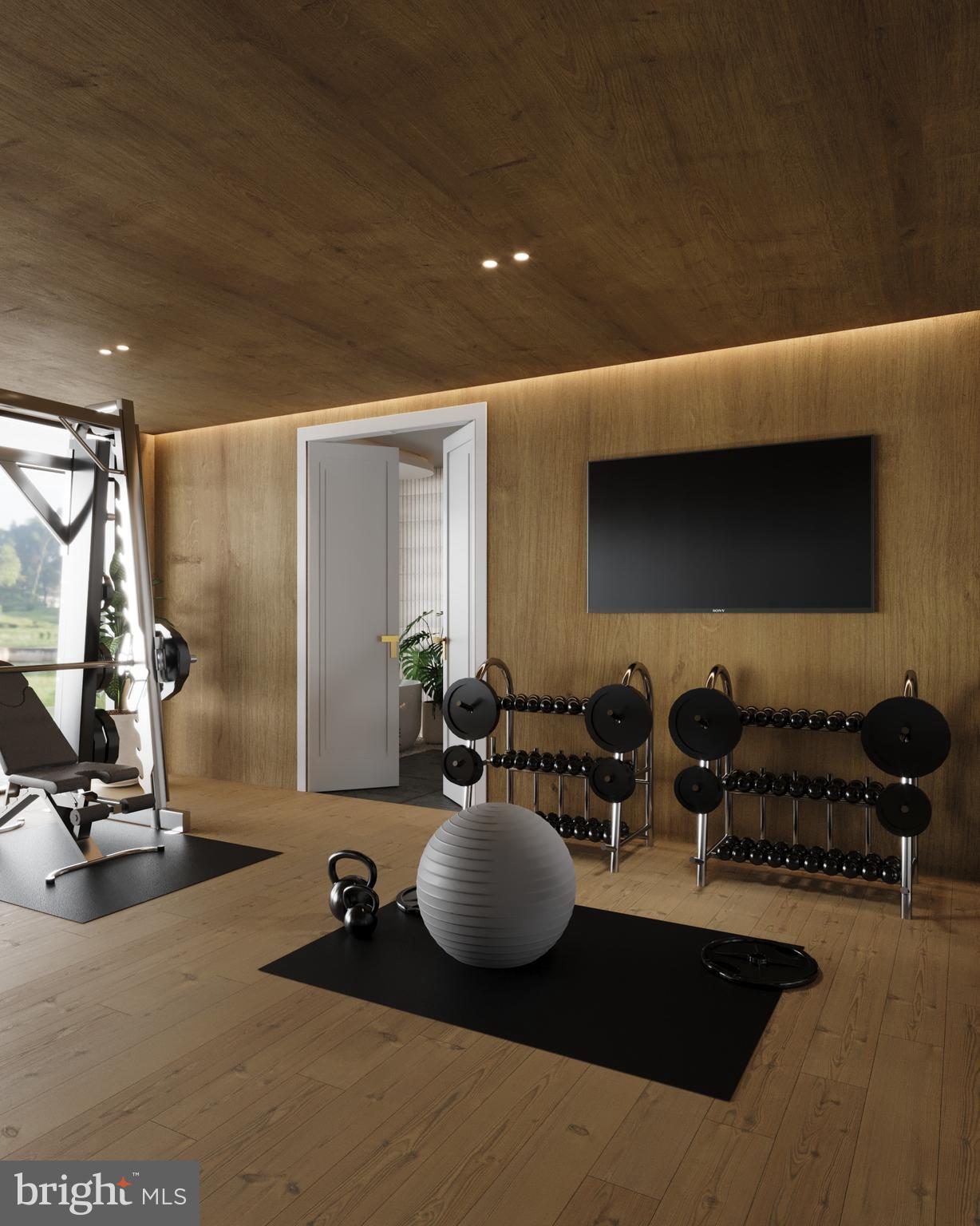 8111 Georgetown Pike McLean, VA 22102 - Photo 33 of 49 a room with gym equipment and a large mirror