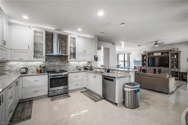 a kitchen with a sink stove and cabinets