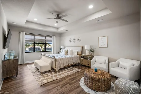 a bedroom with a large bed and a window