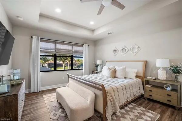 a bedroom with bed and window