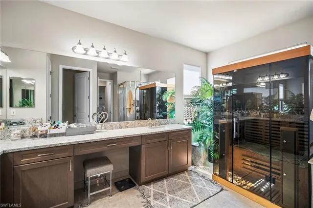 a bedroom with two beds and a window