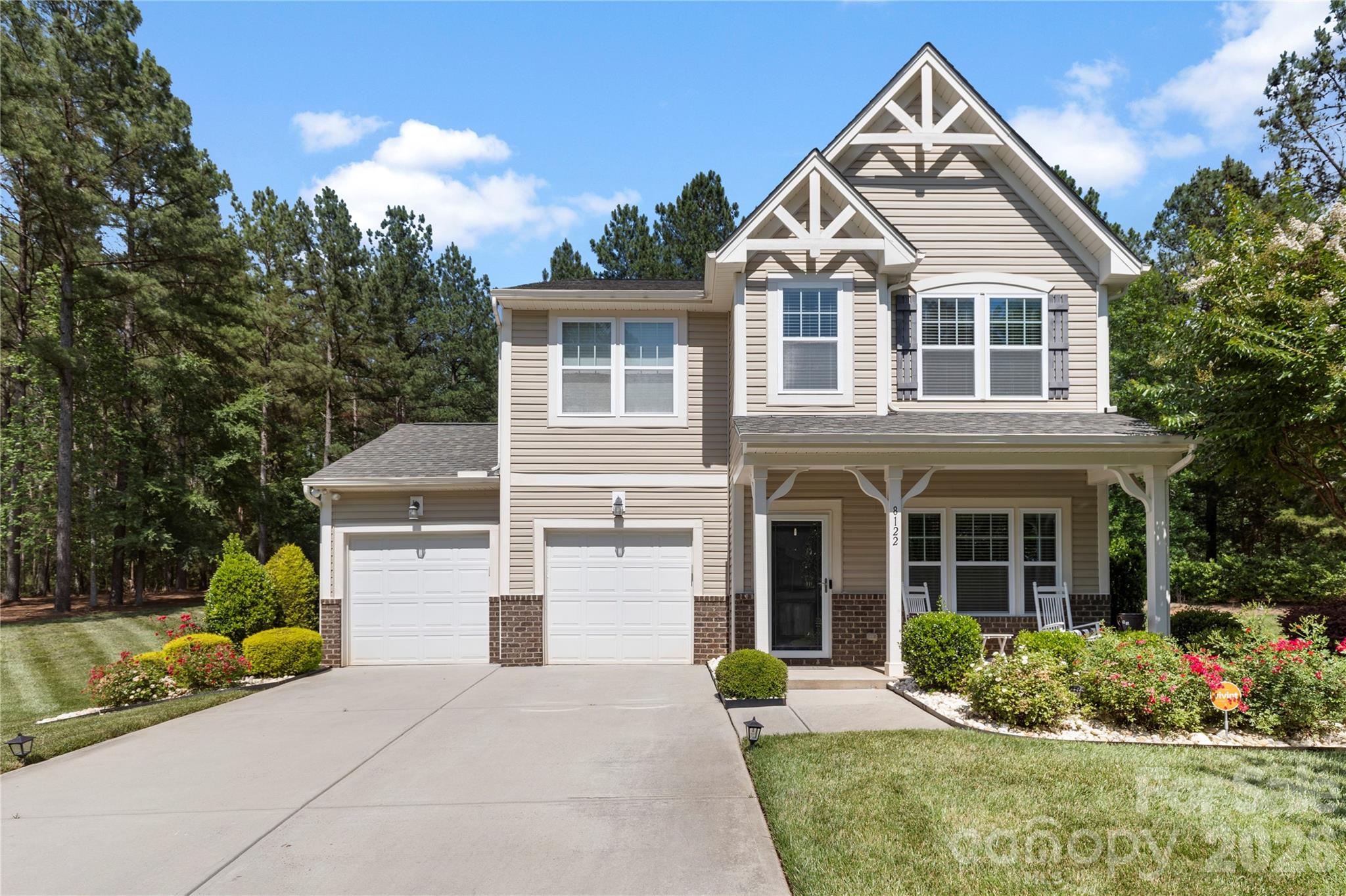 8122 Mossy Rock Road Waxhaw, NC 28173 - Photo 2 of 28 a front view of a house with garden