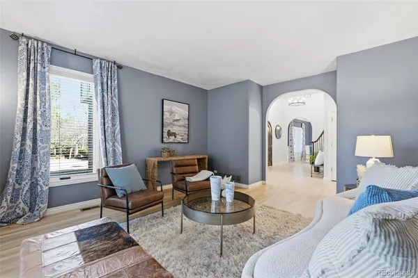 a living room with furniture and a window