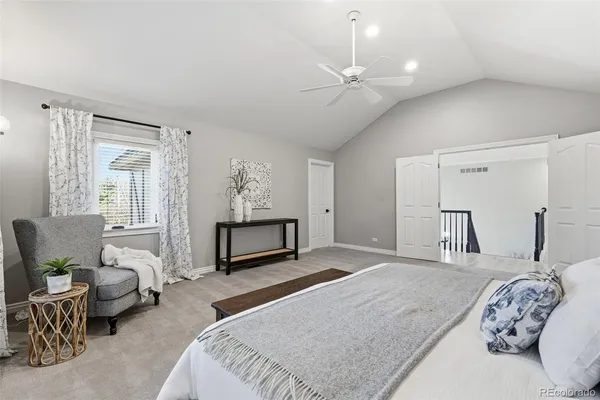 a bedroom with bed and a couch