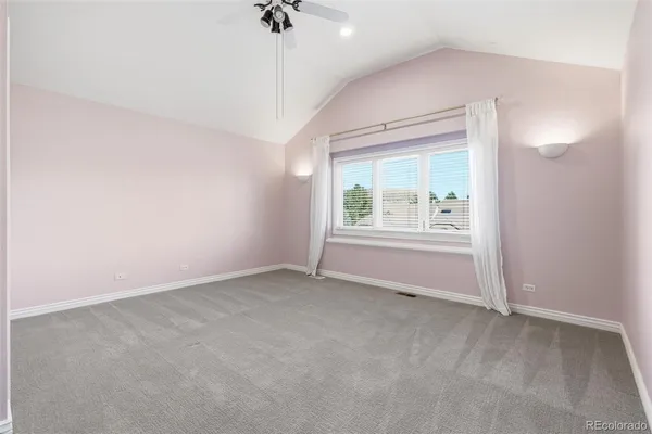 an empty room with a empty space and windows