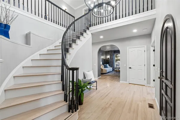 a view of entryway and hall with wooden floor