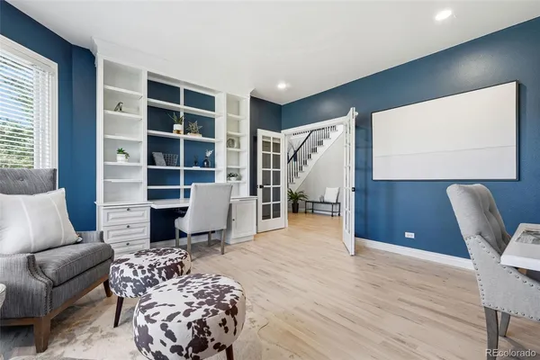 a living room with furniture and a rug