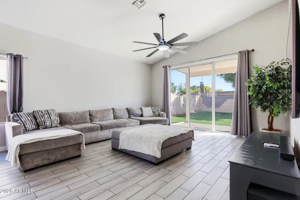 a living room with furniture and a large window